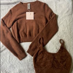 Kittenish sweater and lounging bra.